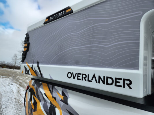 Tufport Overlander mid-size on Tacoma side view with custom decals