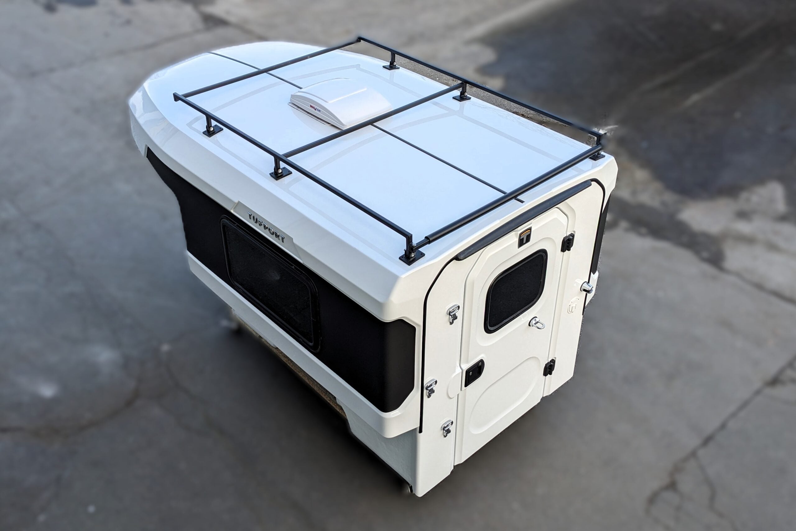 Tufport model T65 with a roof rack with tough black powder coating